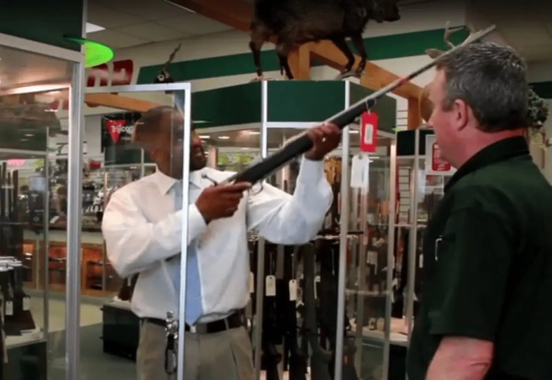 The Salesman showing rifle to customer at H&H Shooting Sports in Oklahoma City